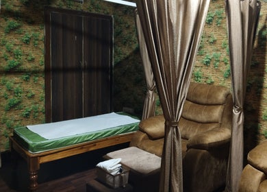 Relaxing interior of Footvarma, Chennai, Tamil Nadu, IN showcasing luxurious massage chairs and serene decor.
