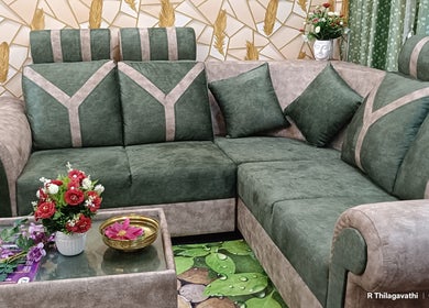 Elegant green sofa with floral decor at Footvarma, Chennai, Tamil Nadu, IN.