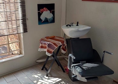 Cozy washing station at D's Hair Salon, Krugersdorp, Gauteng, ZA, with modern design and natural light.
