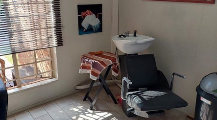 Cozy washing station at D's Hair Salon, Krugersdorp, Gauteng, ZA, with modern design and natural light.
