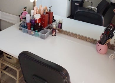 D's Hair Salon in Krugersdorp, Gauteng, ZA, stylish hairdressing station with tools and products.
