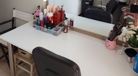 D's Hair Salon in Krugersdorp, Gauteng, ZA, stylish hairdressing station with tools and products.