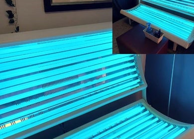 Illuminated tanning beds at D's Hair Salon in Krugersdorp, Gauteng, ZA for a perfect bronze glow.