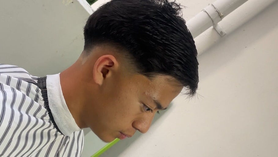 Sleek haircut at gbblendz in Singapore, Singapore, SG showcasing precision grooming.