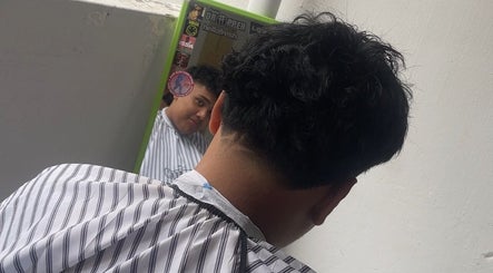 Client viewing fresh haircut in mirror at gblendez, Singapore, Singapore, SG salon.