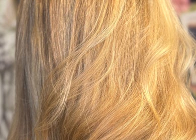 Close-up of elegant, golden hair styling at Jades Gorgeous Hair in Leighton Buzzard, England, GB.