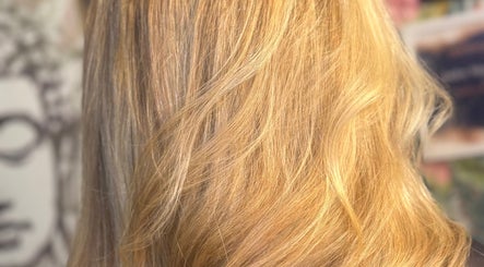 Close-up of elegant, golden hair styling at Jades Gorgeous Hair in Leighton Buzzard, England, GB.