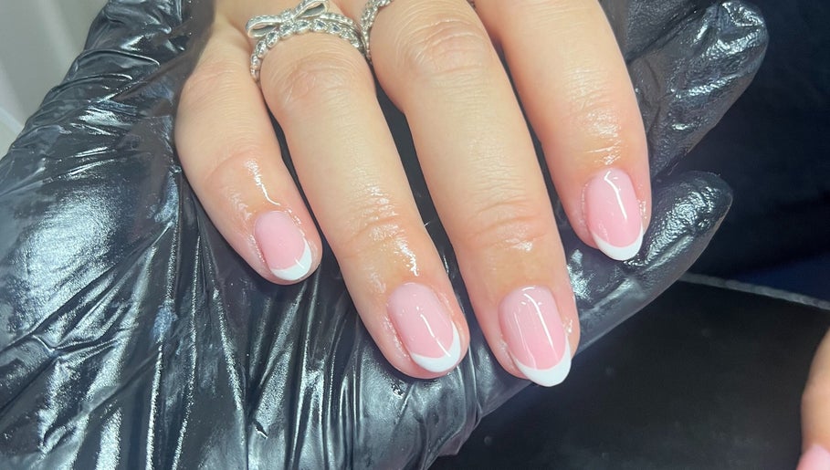 Stylish French manicure at The Nail Lab Essex in Witham, England, GB, displaying elegant pink nail art.