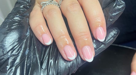 Stylish French manicure at The Nail Lab Essex in Witham, England, GB, displaying elegant pink nail art.