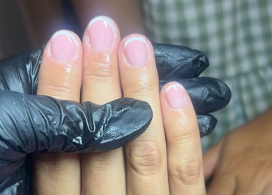 Freshly manicured nails with French tips at The Nail Lab Essex, Witham, England, GB.