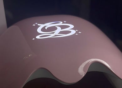 Close-up of a sleek logo at Built By Mikaela, Skewen, Wales, GB. Modern design on beauty equipment.