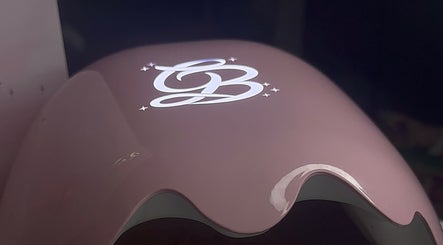 Close-up of a sleek logo at Built By Mikaela, Skewen, Wales, GB. Modern design on beauty equipment.