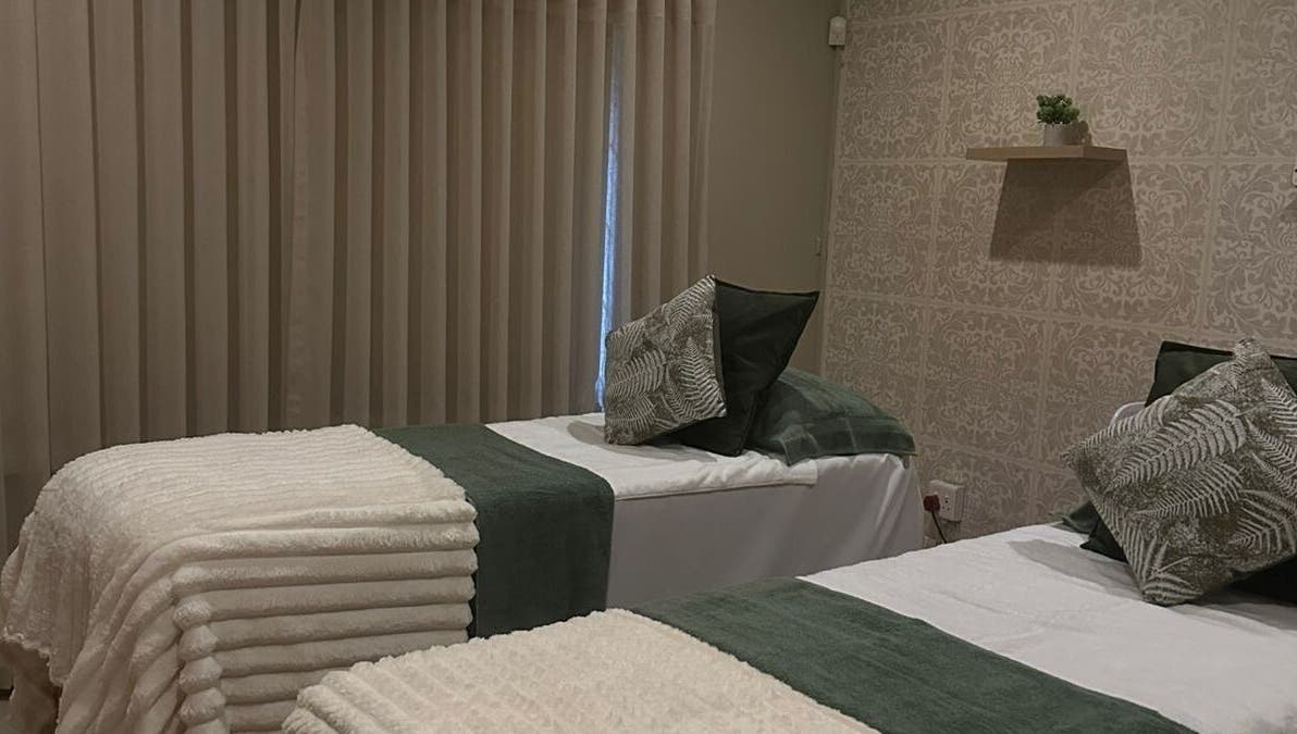 Cozy treatment beds at Imar’ Amani Herbal Alchemy in Pretoria, Gauteng, ZA, offering tranquil relaxation.