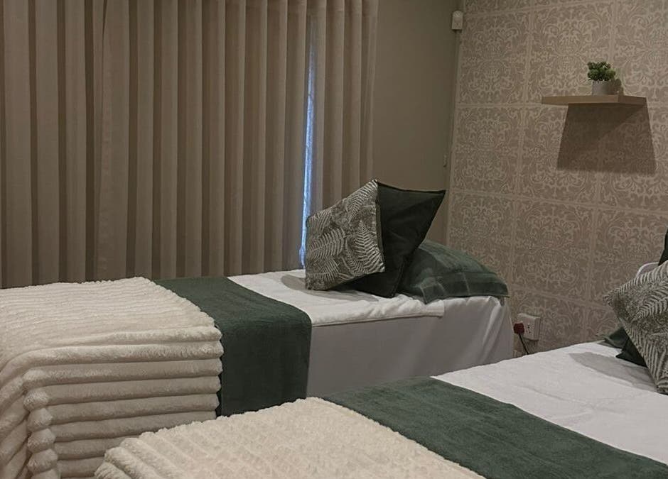 Cozy treatment beds at Imar’ Amani Herbal Alchemy in Pretoria, Gauteng, ZA, offering tranquil relaxation.