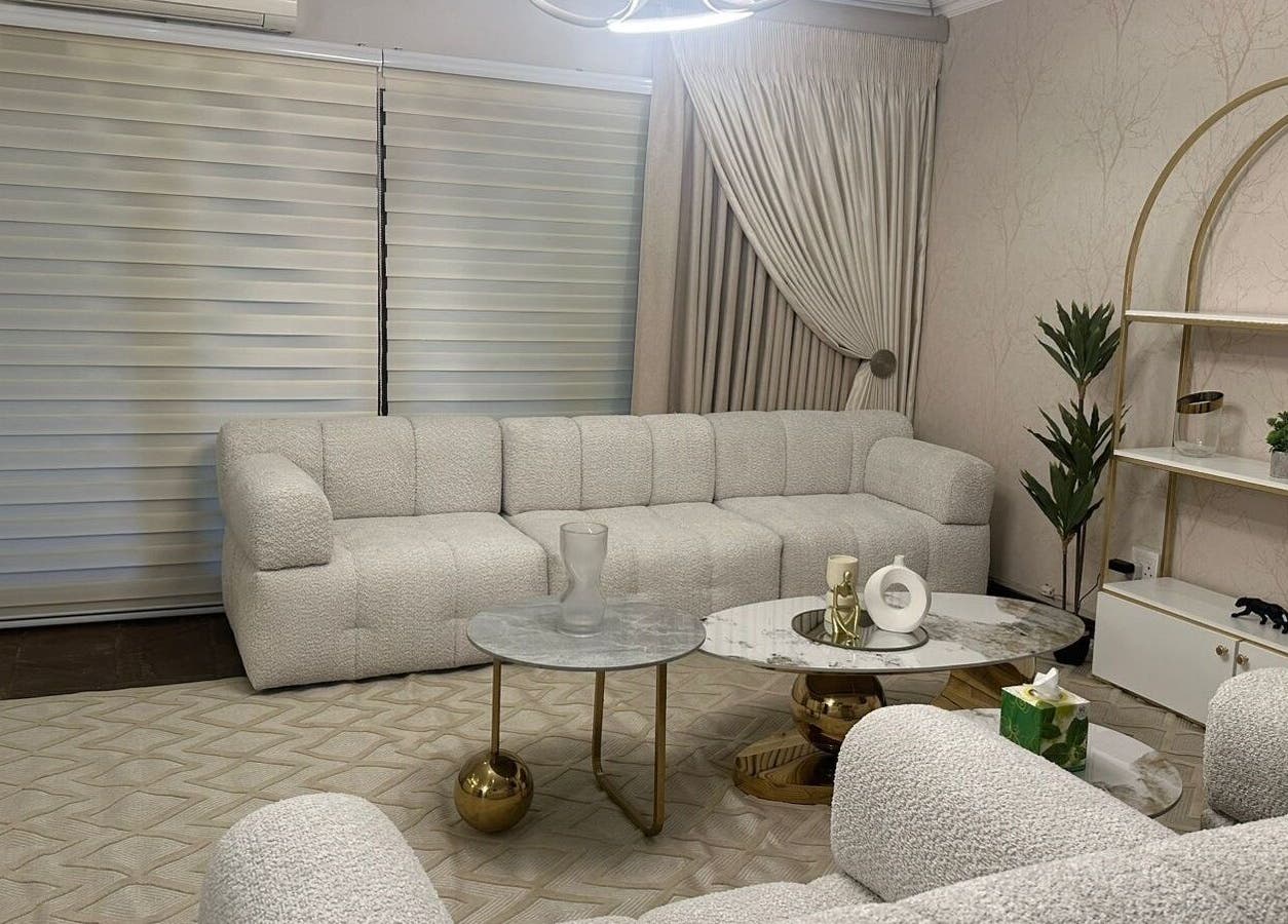 Elegant lounge at Imar’ Amani Herbal Alchemy, Pretoria, Gauteng, ZA, featuring plush sofas and chic decor.