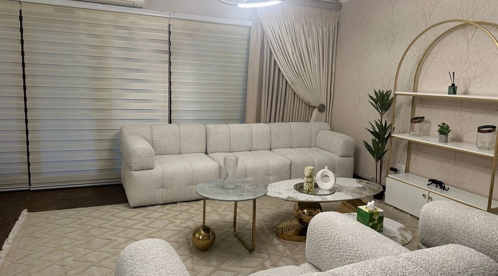 Elegant lounge at Imar’ Amani Herbal Alchemy, Pretoria, Gauteng, ZA, featuring plush sofas and chic decor.