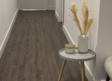 Calm, minimalist hallway at Rosem Health Clinic, Nottingham, England, GB with wooden floors and decor.