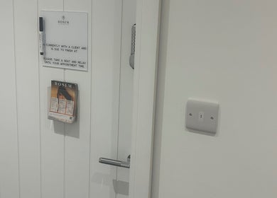 Entrance of Rosem Health Clinic in Nottingham, England, GB with informative signs and brochures.