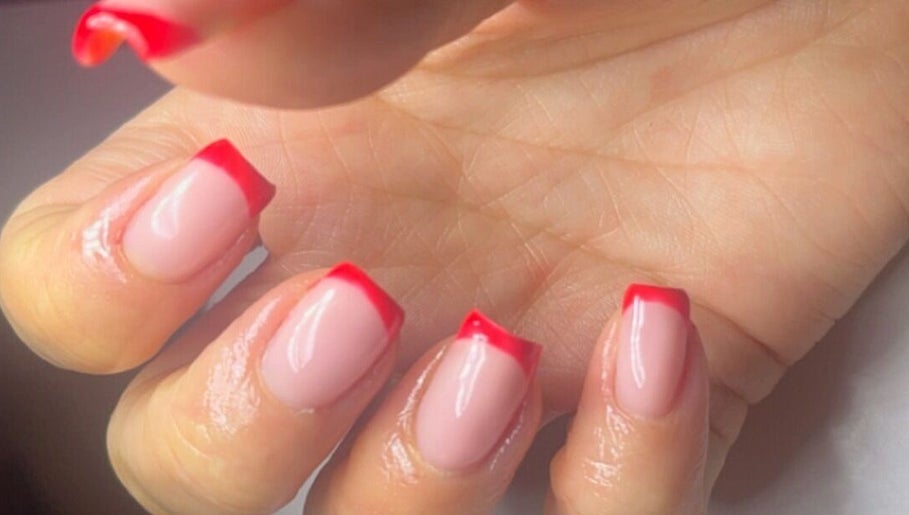 Stylish red-tipped manicure at Beauty by Mel, Glenfield, England, GB.