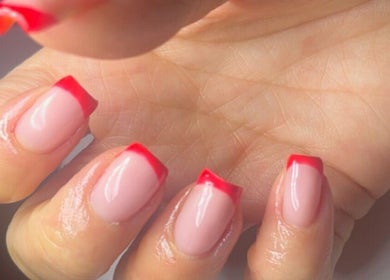 Stylish red-tipped manicure at Beauty by Mel, Glenfield, England, GB.