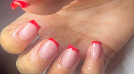 Stylish red-tipped manicure at Beauty by Mel, Glenfield, England, GB.