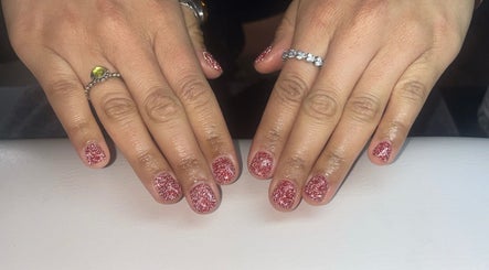 Sparkling pink manicure at Beauty by Mel in Glenfield, England, GB showcasing elegant nail art.