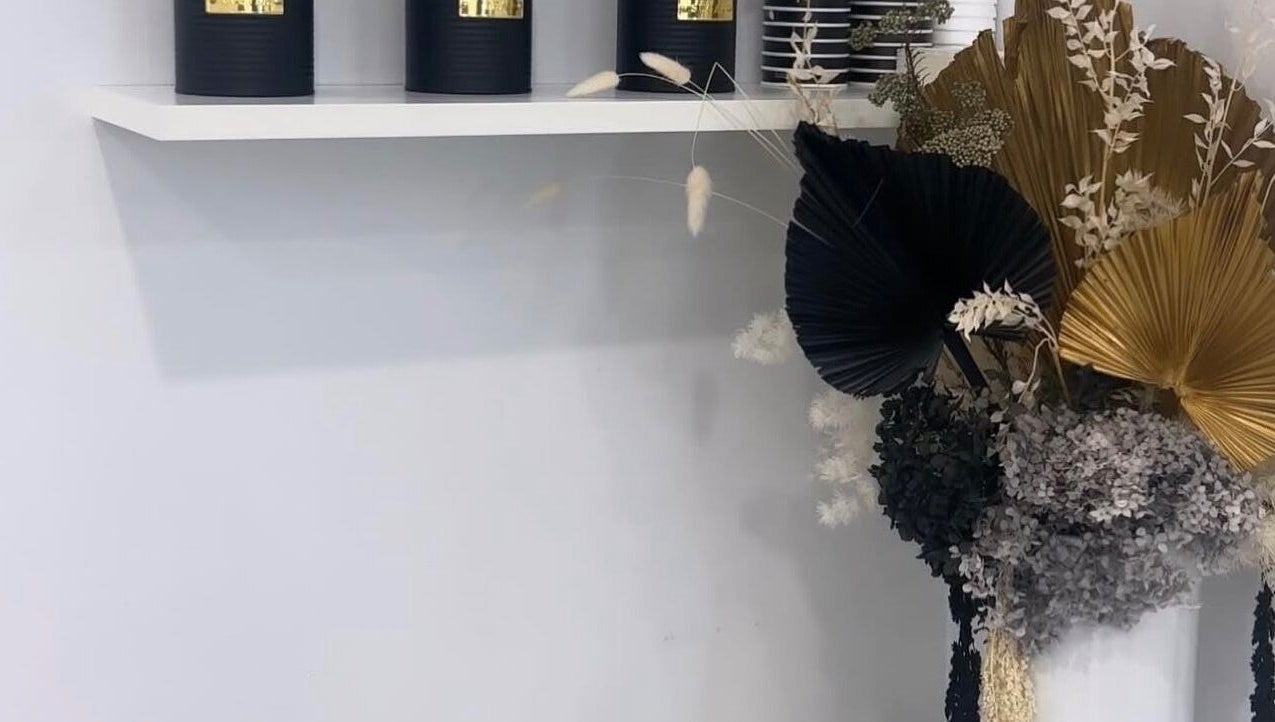 Elegant decor with black candles and floral display at The Gel Edit, Rockdale, New South Wales, AU.