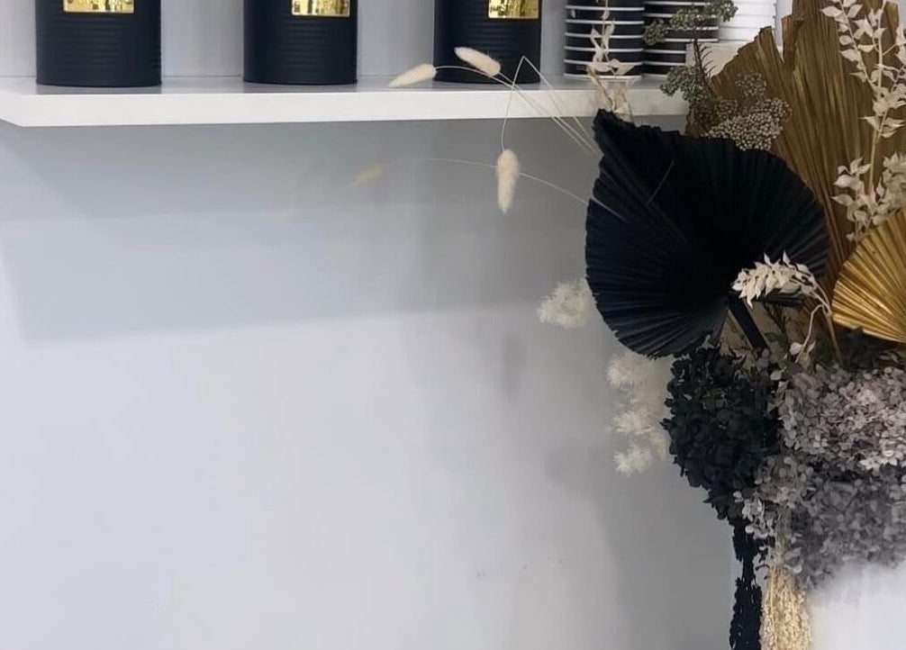 Elegant decor with black candles and floral display at The Gel Edit, Rockdale, New South Wales, AU.