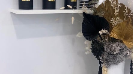 Elegant decor with black candles and floral display at The Gel Edit, Rockdale, New South Wales, AU.