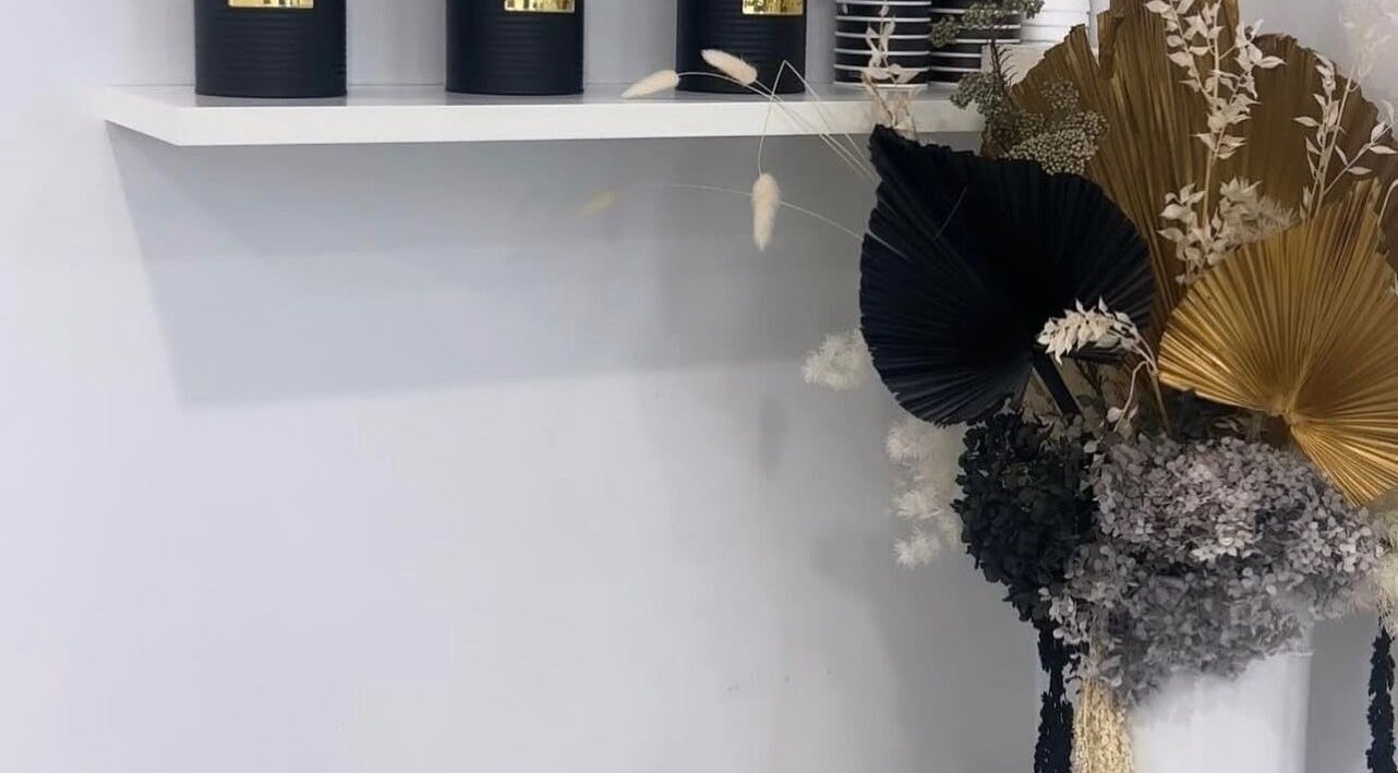 Elegant decor with black candles and floral display at The Gel Edit, Rockdale, New South Wales, AU.