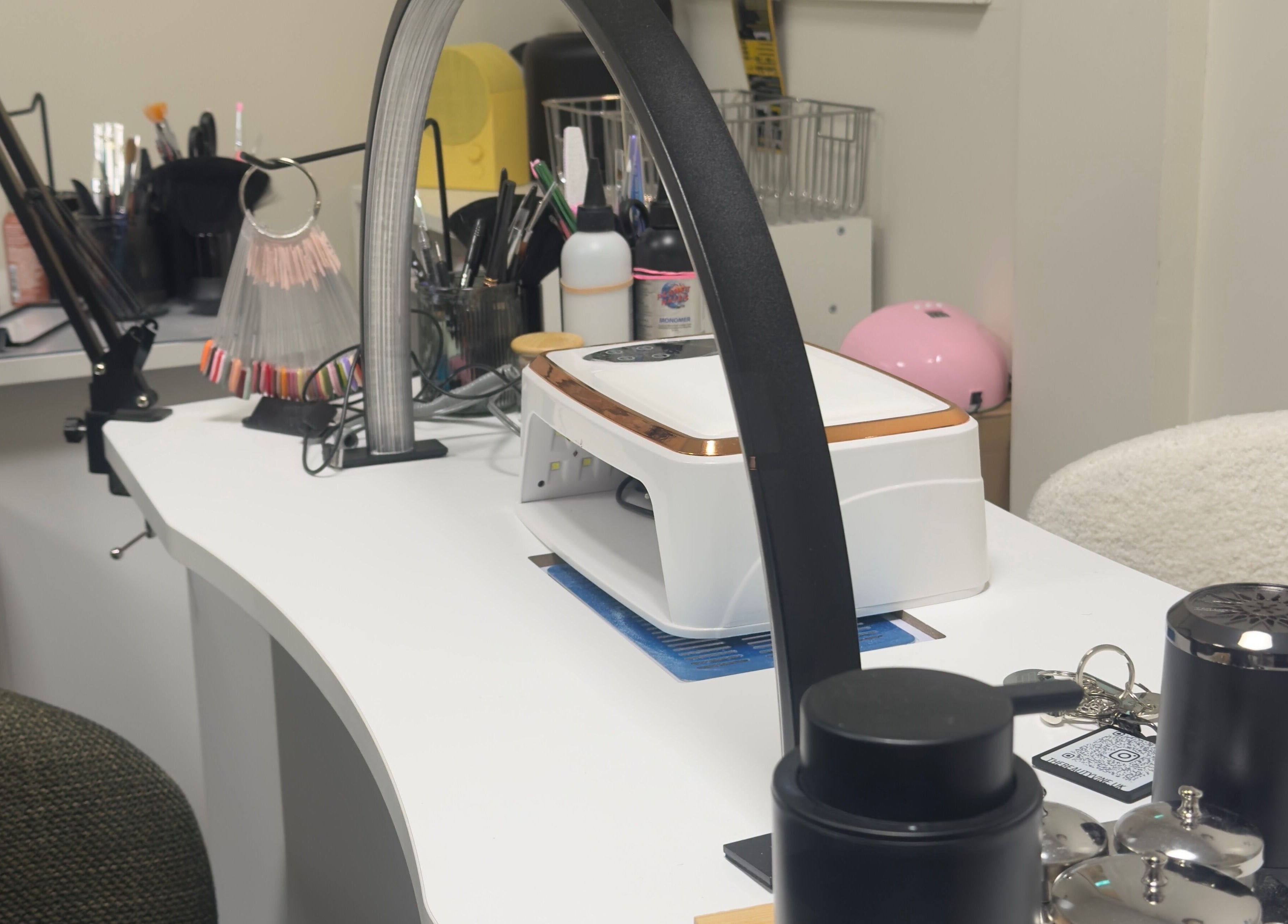 Modern nail station at TheBeautyVine, Birmingham, England, GB. Equipped with tools for manicure services.