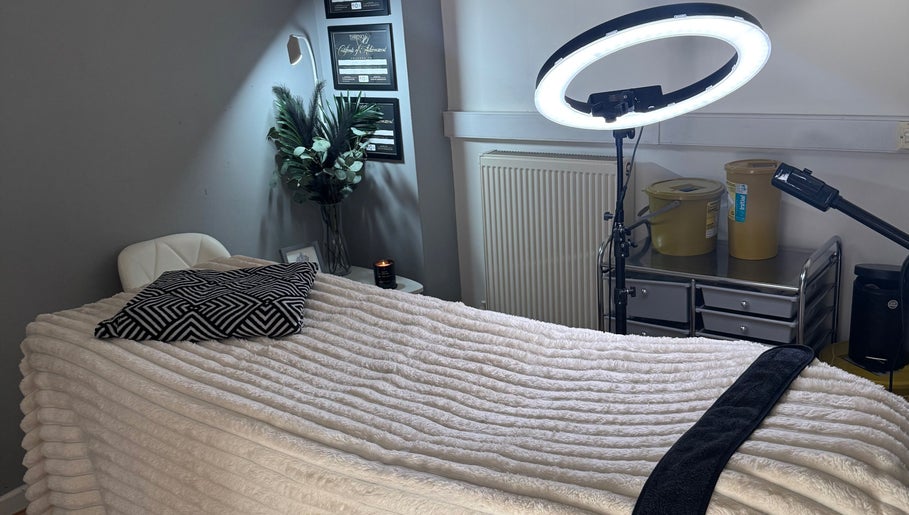 Cozy treatment room at La Bella Beauty in Golborne, England, GB with plush bedding and soft lighting.