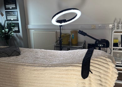 Cozy treatment room at La Bella Beauty in Golborne, England, GB with soft lighting and comfortable bed.
