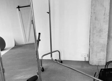 Modern studio interior at Mac.inkd, Philadelphia, Pennsylvania, US with sleek metal racks and minimal design.