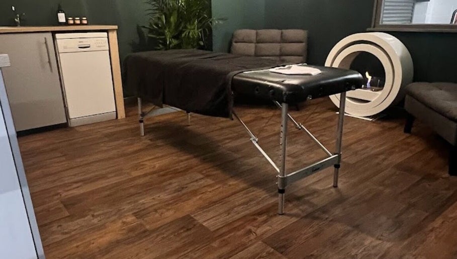 Treatment room at LS Sport Therapy in Leeds, England, GB with massage table and modern decor for a serene experience.