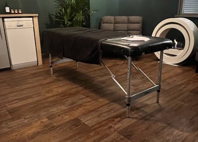 Treatment room at LS Sport Therapy in Leeds, England, GB with massage table and modern decor for a serene experience.