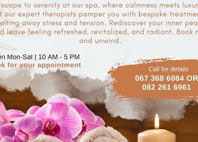 Pink orchids and candles promote relaxation at Healingroomspa, Emalahleni, Mpumalanga, ZA. Book your appointment.