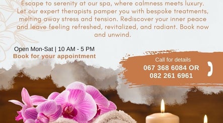 Pink orchids and candles promote relaxation at Healingroomspa, Emalahleni, Mpumalanga, ZA. Book your appointment.