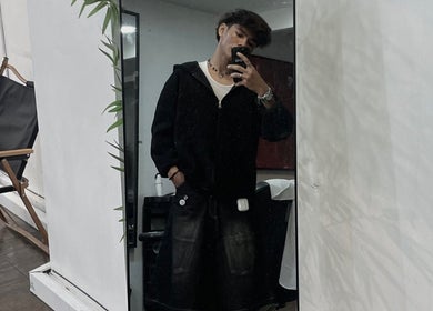 Client capturing a stylish mirror selfie at zack.haircuts, Klang, Selangor, MY. Modern salon vibe.