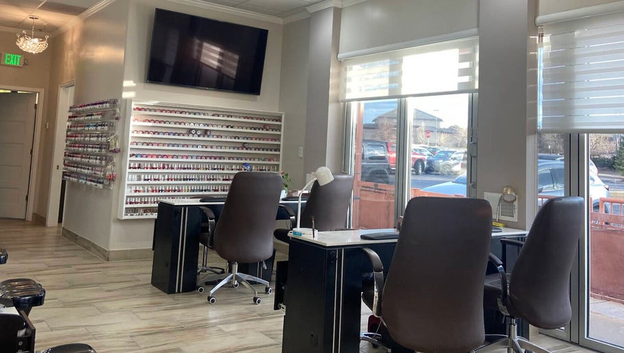 Interior view of La Vogue Nail & Lash in Lone Tree, Colorado, US, featuring elegant nail service stations.