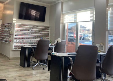 Interior view of La Vogue Nail & Lash in Lone Tree, Colorado, US, featuring elegant nail service stations.