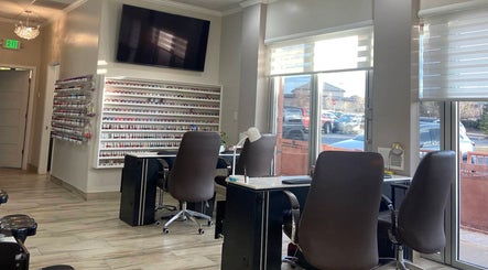 Interior view of La Vogue Nail & Lash in Lone Tree, Colorado, US, featuring elegant nail service stations.