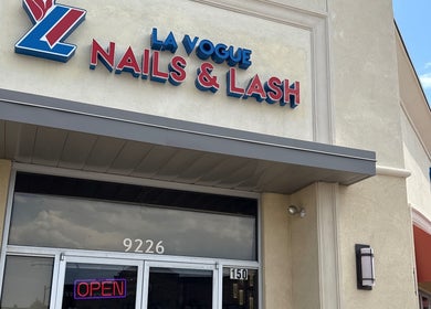 Entrance of La Vogue Nail & Lash in Lone Tree, Colorado, US featuring a vibrant sign.