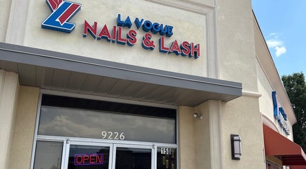 Entrance of La Vogue Nail & Lash in Lone Tree, Colorado, US featuring a vibrant sign.