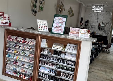 La Vogue Nail & Lash in Lone Tree, Colorado showcases diverse nail polish and care products in neat display.