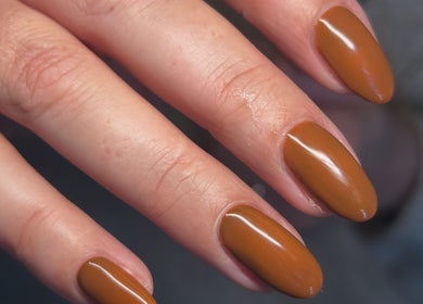 Stylish brown manicure at Femme Lounge, Rutherglen, Scotland, GB for elegant hand beauty.