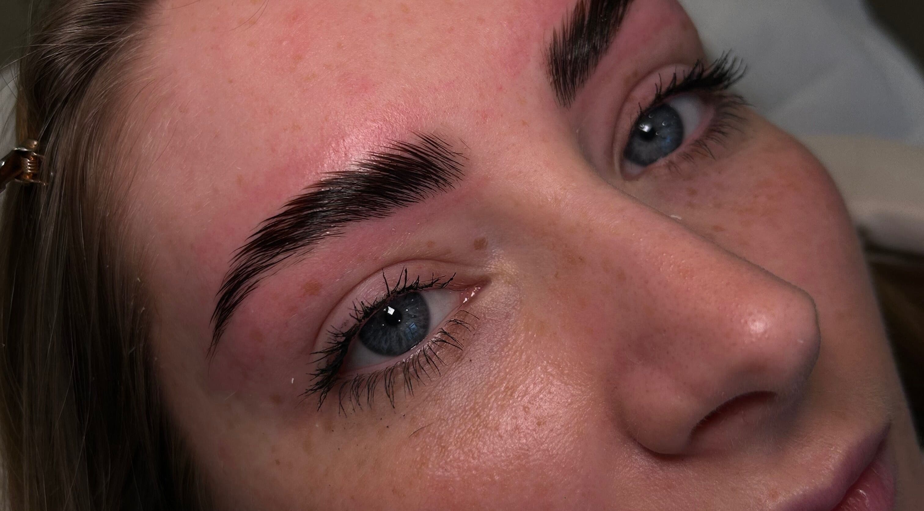 Closeup of expertly shaped eyebrows at Femme Lounge, South Lanarkshire, Scotland, GB, showcasing beauty services.