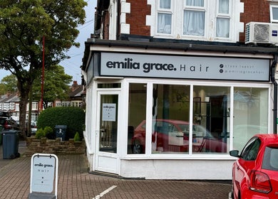 Exterior of Emilia Grace Hair salon in Birmingham, England, GB, featuring signage and a street view.