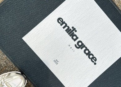 Entrance mat with Emilia Grace Hair logo at Birmingham, England, GB, welcoming clients.