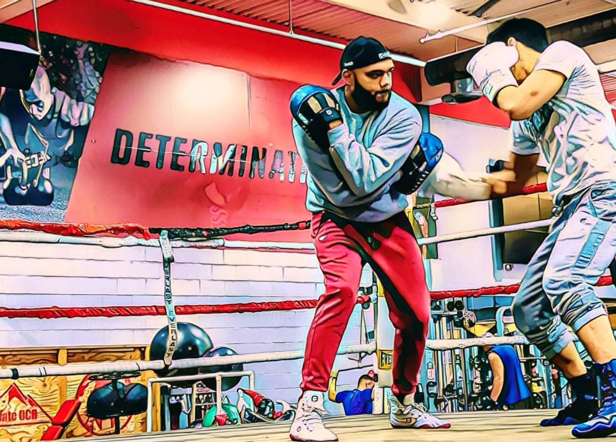 Boxers sparring in a lively gym at The Flow State Method LLC in Branchburg, New Jersey, US.